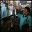 A man shops by torchlight in a Caracas shop on 13 January