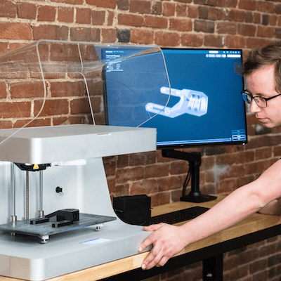 An engineer using an Ultimaker 3D printer.