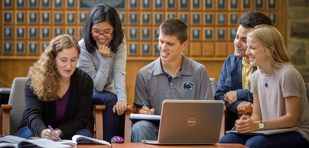 five students working on a group project in a study area