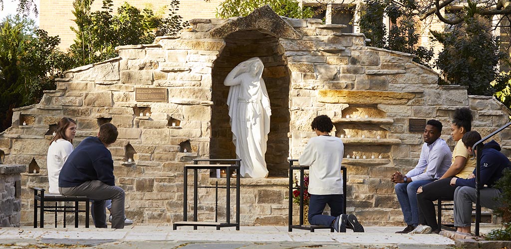 Virgin Mary grotto outside of St. Joan of Arc Chapel