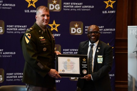 Col. Marc Austin, Fort Stewart-Hunter Army Airfield garrison commander, alongside Mayor Karl Riles, pose for a photo after signing an agreement with the City of Hinesville to mark their collaboration supporting the U.S. Army PaYS program.