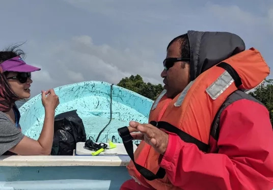 Christine Lee and Deepak Mishra of the University of Georgia conducting field work in Belize