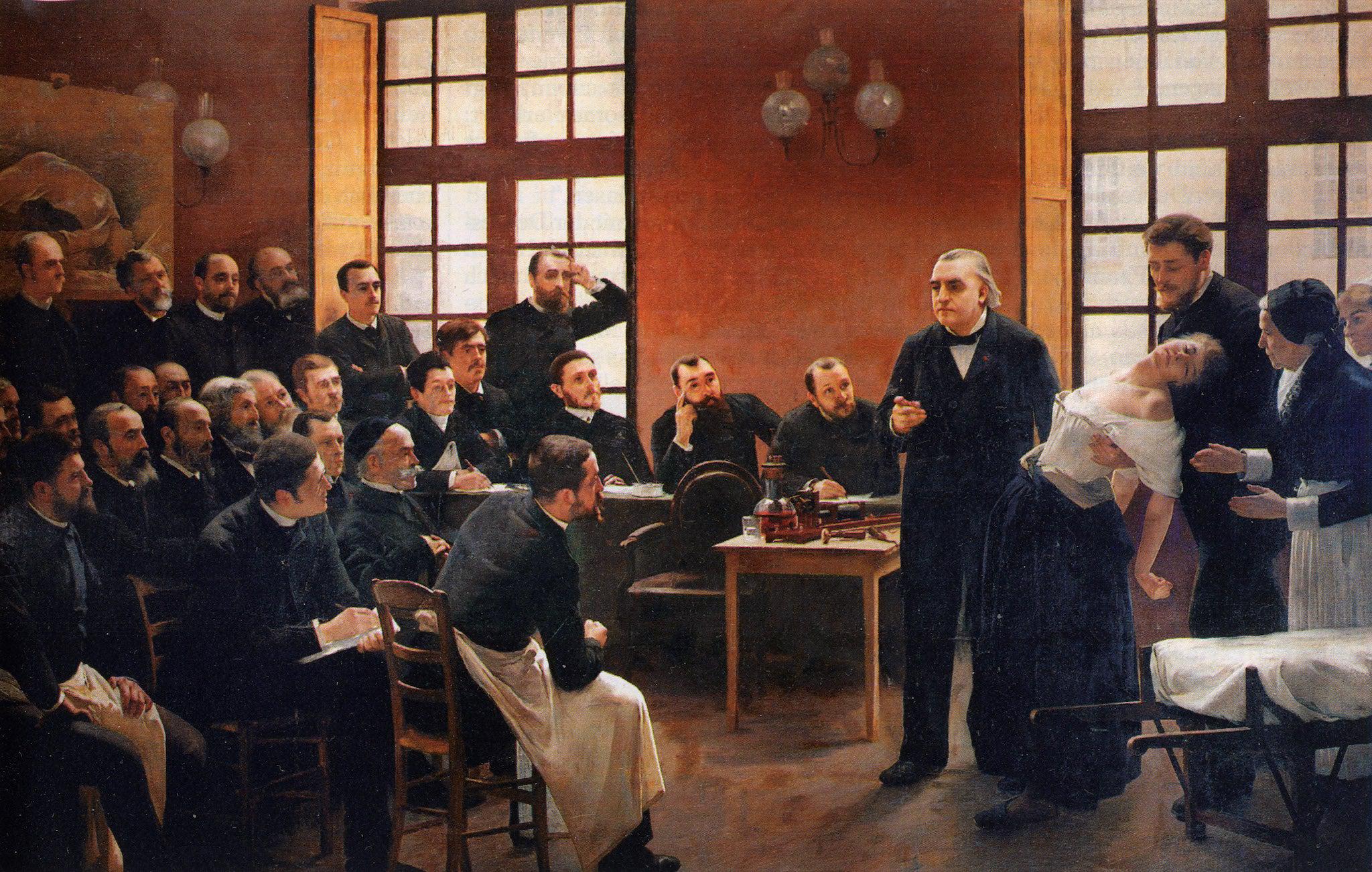 Jean-Martin Charcot presents a half-dressed woman to demonstrate hysteria to a group of men in ‘A Clinical Lesson at the Salpêtrière’ by André Brouillet (1887) (Paris Descartes University, Paris)