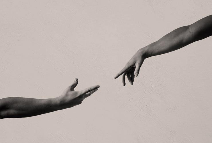 The Art of Receiving: The Greatest Act of Generosity, by Rakel Chafir. Photograph of two hands outreached by Sebastian Dumitru