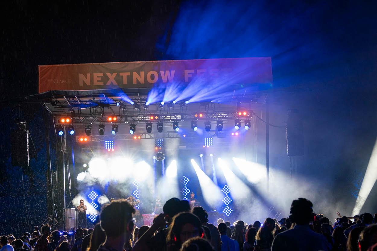 Students watch an outdoor concert at NextNOW Fest.
