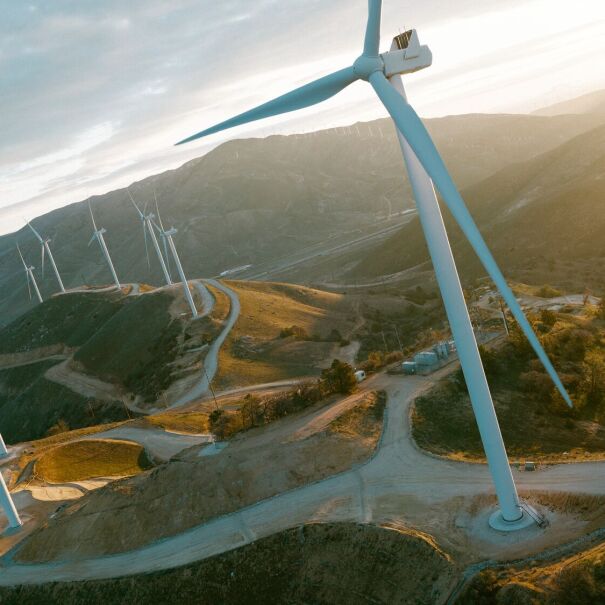 Renewable energy landscape with wind turbines and river