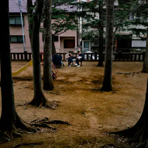 A family picnicking in the park at Taishido Hachiman Jinja Shrine