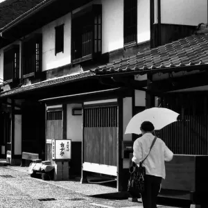 Woman walking with umbrella