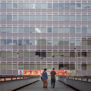 Two men on pedestrian bridge