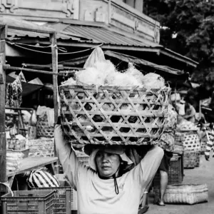 Woman carrying big basket