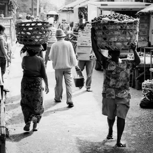 Woman putting big basket on head