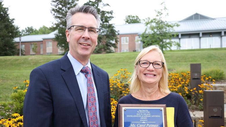 Penn State Behrend Chancellor Ralph Ford poses with Carol Putman, associate teaching professor of management