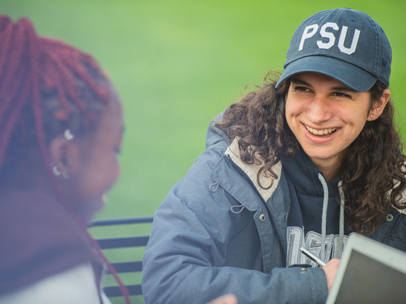 Two female students talking to each other