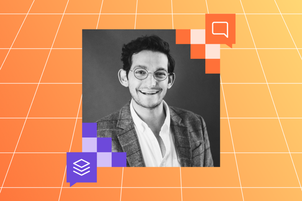 Matt Klein, Reddit’s head of global foresight, smiling while wearing glasses and a blazer. The background is a gradient of orange and purple squares with white grid lines.
