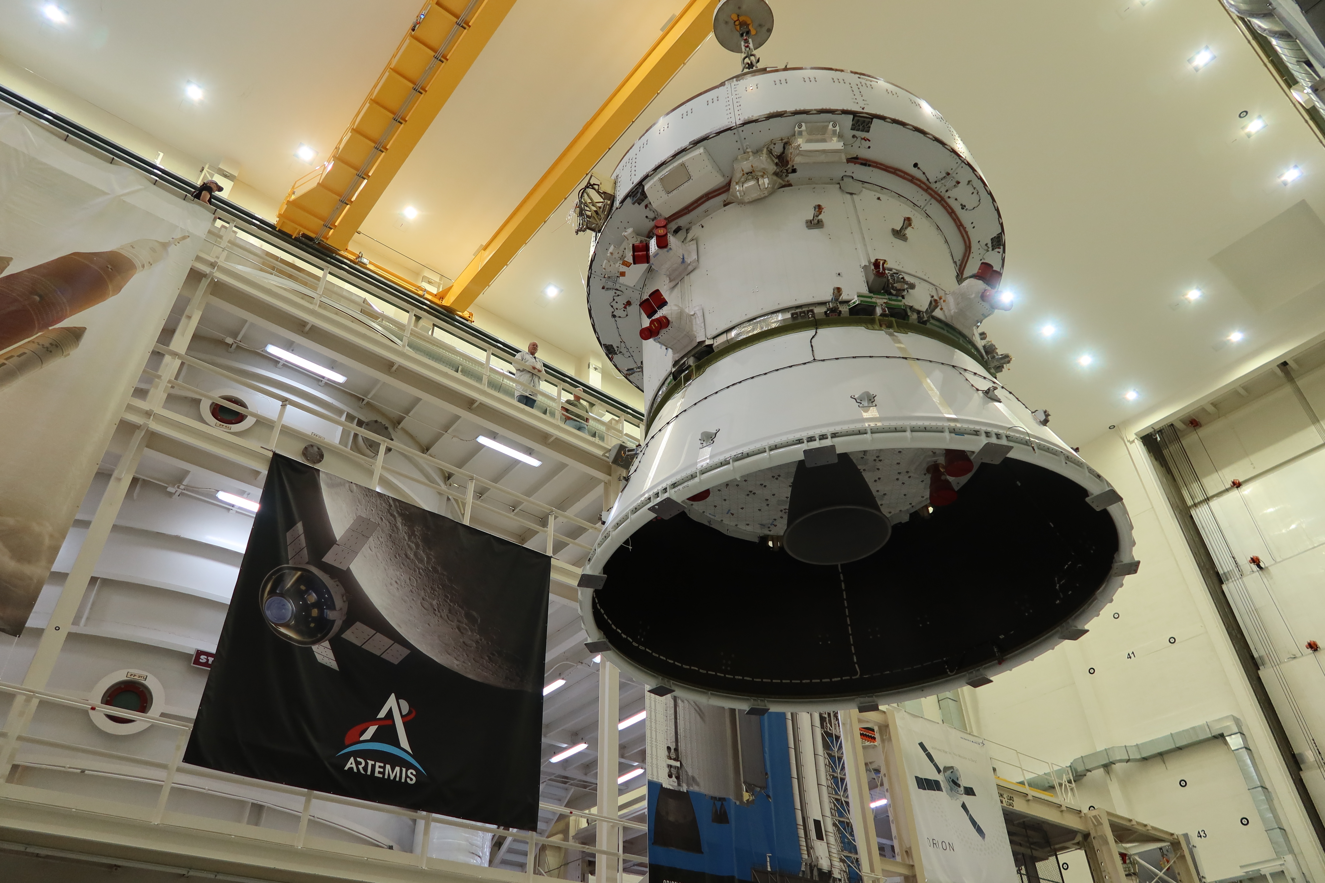 After completing electromagnetic compatibility and interference testing, the Artemis II Orion spacecraft is returned to the FAST cell via crane inside the Neil A. Armstrong Operations and Checkout Building at NASA's Kennedy Space Center in Florida on Saturday, April 27, 2024.