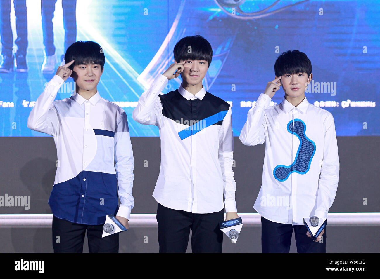 (From left) Yiyang Qianxi, Wang Junkai and Wang Yuan of Chinese boy group TFBoys attend a launch event for their new web drama "Finding Soul" in Beiji Stock Photo