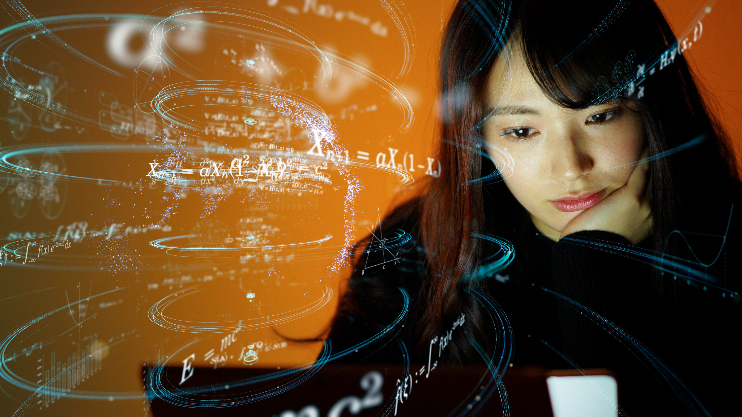 math equations swirl around the head of a girl looking at a computer display