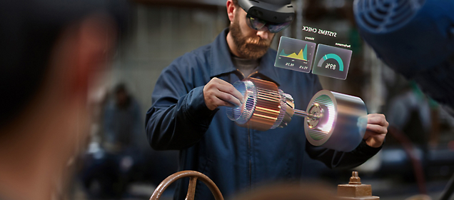 Man using augmented reality interface while working on a mechanical part.