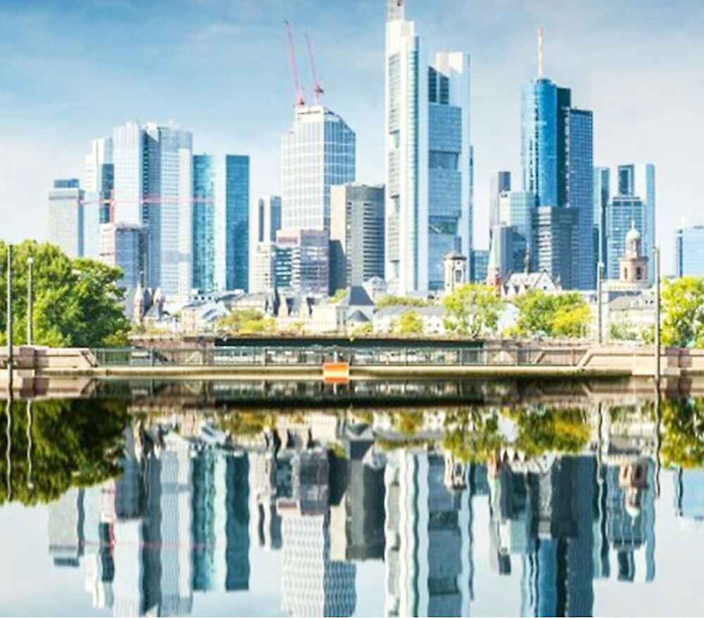 A city skyline with a body of water