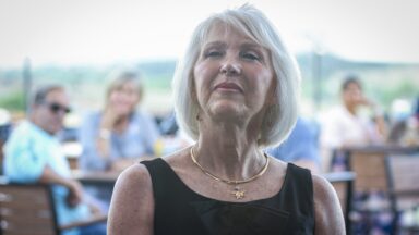 A picture of Tina Peters, with other people sitting at tables in the background.