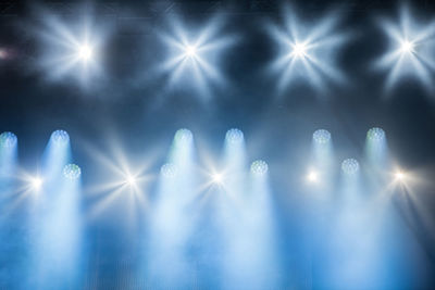 Illuminated stage lights at music festival