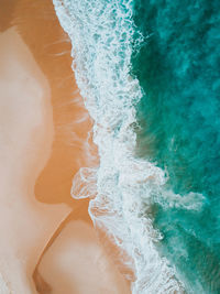 High angle view of wave on beach