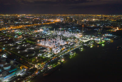 High angle view of illuminated city buildings at night