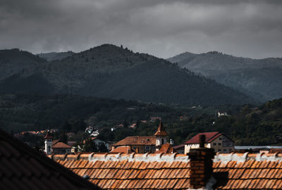 High angle view of townscape and mountains against sky