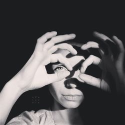 Close-up of woman doing hand gestures with fingers