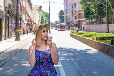 Young woman on street in city