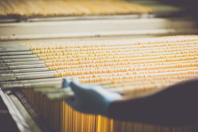 Cropped image of person making spaghetti