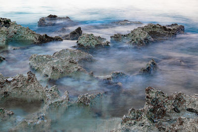 High angle view of rocks in sea