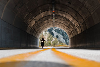 Niceley composed picture with circled tunnel and a motorcycle rider on the streets.