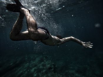 Man swimming undersea