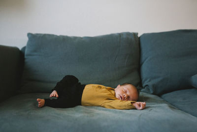 Baby sleeping on sofa