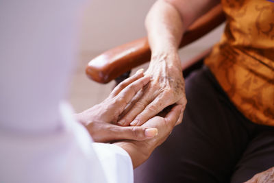 Doctor consoling patient in hospital