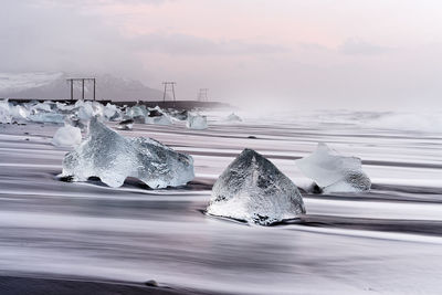 Scenic view of sea against sky during winter