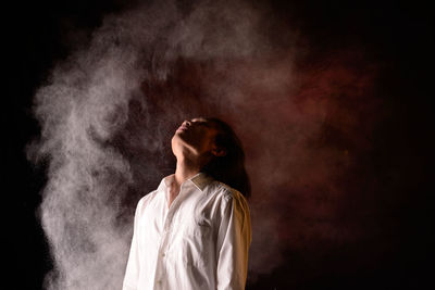 Man with powder black background