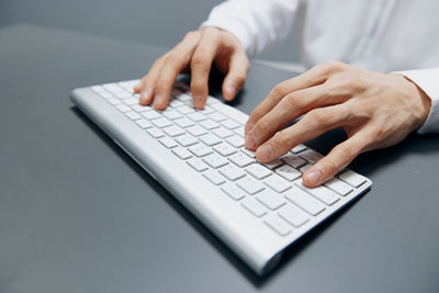 Midsection of man using laptop