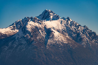 Scenic view of snowcapped mountains against clear sky