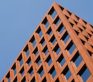 Low angle view of building against clear blue sky