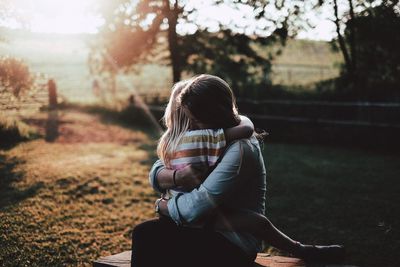 Mother hugging her daughter