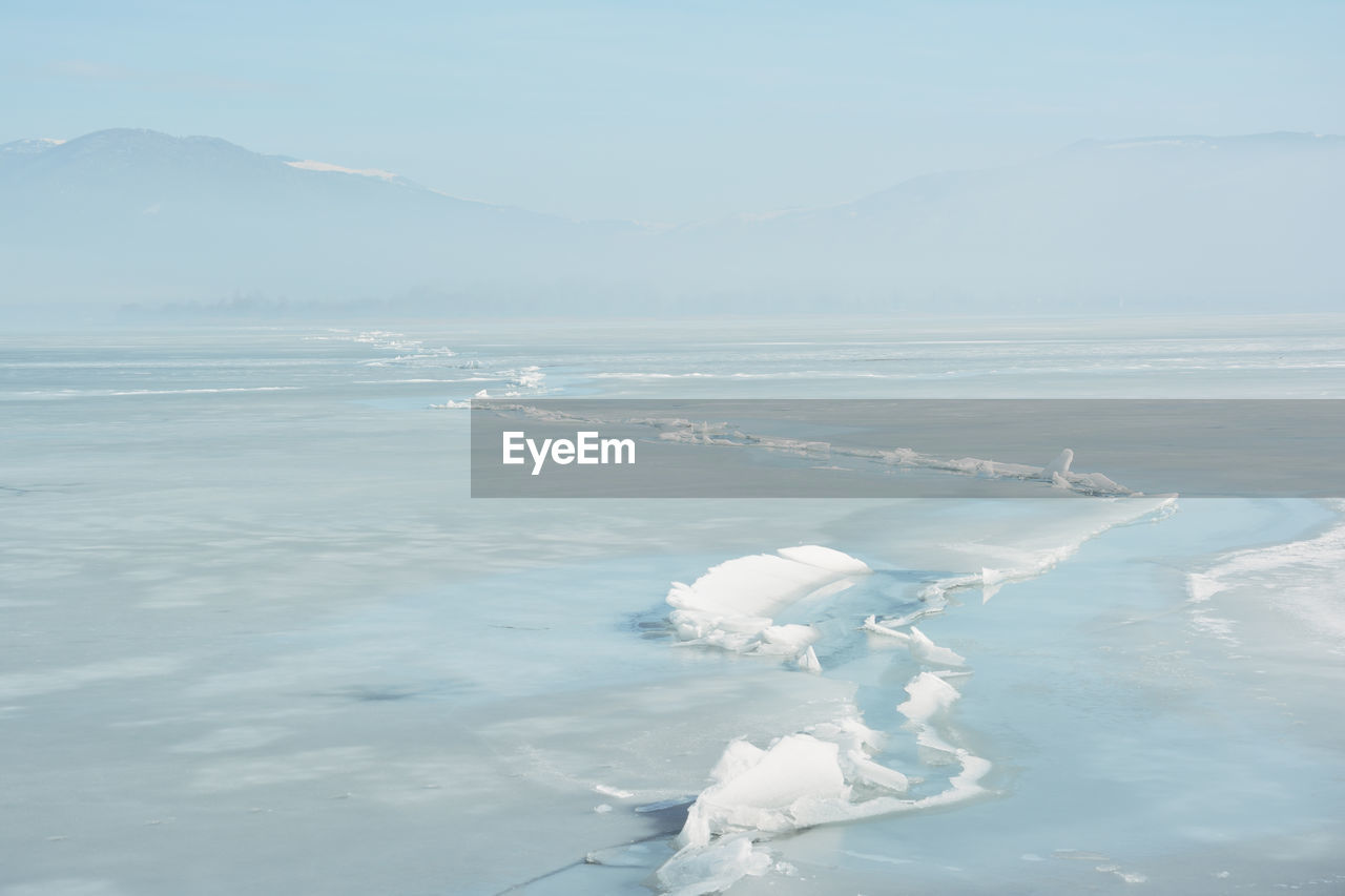 Huge crack in the surface of the frozen lake orestiada in kastoria , greece