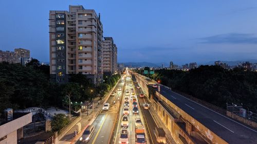 High angle view of light trails on road in city