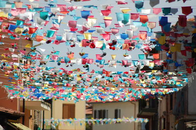 Low angle view of decorations hanging on building