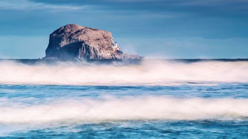 Waves flowing at bass rock island