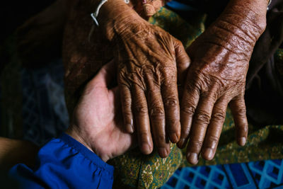 Cropped hands of people at home