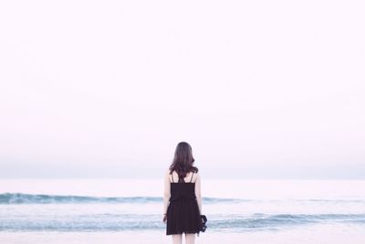 Woman standing on beach