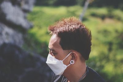 Portrait of young man outdoors