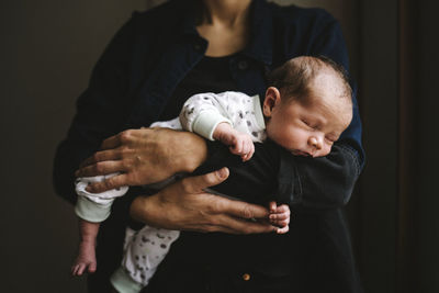 Mother holding newborn baby